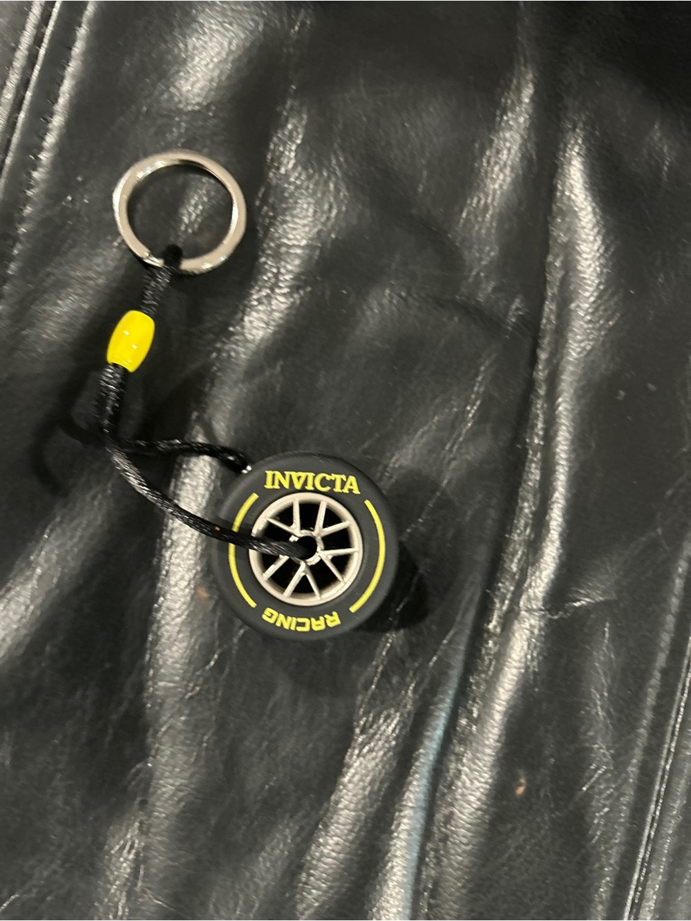 Invicta Black tire Keychain with Yellow Accent